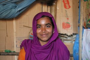 Young girl smiles at camera