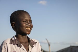 Jok stands outside is home in Sudan.