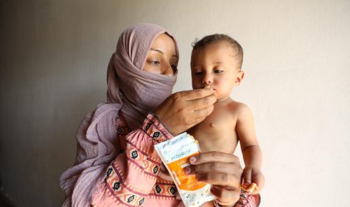 Bayan, 1, being fed therapeutic food by her mother, Manar