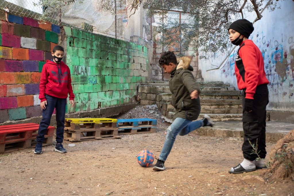 Adam, 14, playing football with his friends at a Save the Children supported education centre, in a Palestinian camp in the south of Lebanon