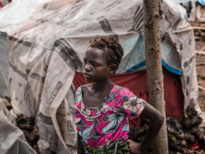 Liliane, 13, in the camp where she is now living