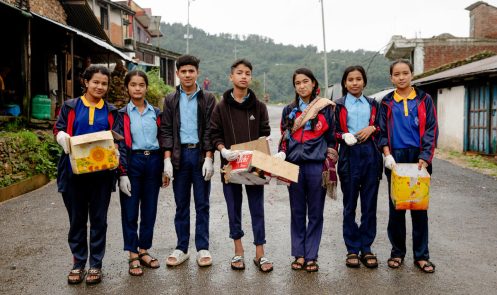 Nisha, 13 (third right), leading a community clean up with her Child Club in Dailekh, Nepal