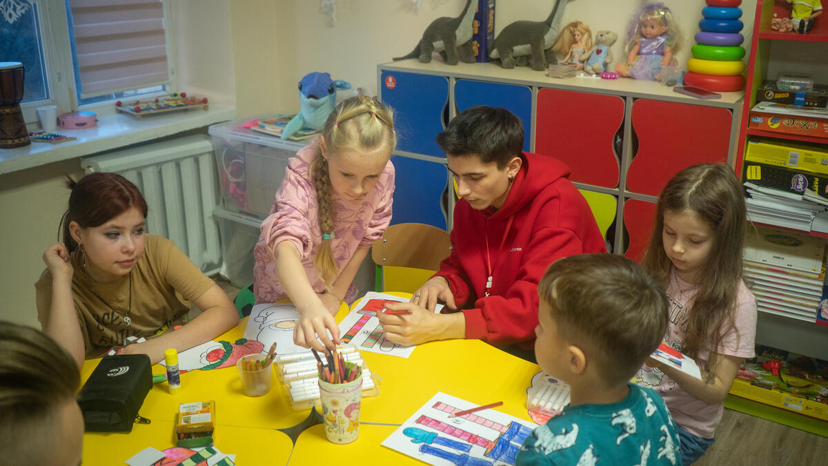 Solomia at crafts lesson in a Child Friendly Space